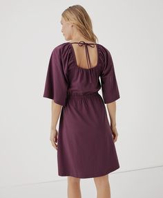 Women's Maroon Luxe Jersey Flutter Sleeve Dress 2XL. Super soft organic women's Luxe Jersey Flutter Sleeve Dress from Wear PACT. Fair Trade Factory. GOTS Certified Made With Organic Cotton Ruffle Sleeve Dress With Smocked Back For Daywear, Casual Butterfly Sleeve Dress With Ruffle Hem, Chic Flowy Mini Dress With Flutter Sleeves, Sundress With Gathered Neckline For Day Out, Chic Daywear Dresses With Smocked Back, Chic Short Sleeve Mini Dress With Gathered Neckline, Casual Sundress With Gathered Neckline, Flowy Dress With Smocked Back For Date Night, Daywear Sundress With Ruffle Sleeves