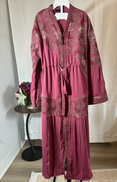 abaya for muslim girls. Comes with a hijab Pink Maxi Length Thobe For Eid, Pink Maxi-length Thobe For Eid, Eid Tunic Dress With Dabka Details, Dabka Tunic Dress For Eid, Tunic Dress With Dabka For Eid, Long Pink Abaya For Eid, Modest Long Sleeve Thobe For Eid, Modest Maxi Length Thobe For Eid, Modest Long Sleeve Pink Maxi Dress