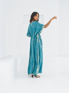 Switch to vacay mode anytime with the Goddess - Tie Dye Kaftan Maxi Dress. This undeniably sexy, breezy maxi dress will have you dreaming of the wind in your hair, the sound of the ocean waves, and the sand under your feet. Experience blissful comfort and breathability whether you’re at home or on vacay with the gorgeous flowy long dress and laid-back loose fit. Crafted in 100% soft, lightweight rayon, this dress features flawless tie-dye patterns and is perfect for tropical beachside vacations, Breezy V-neck Maxi Dress For Poolside, Turquoise Maxi Dress For Beach Cover-up, Turquoise V-neck Maxi Dress For Vacation, Relaxed Fit V-neck Maxi Dress For Vacation, Turquoise Maxi Dress For Beach Cover-up In Spring, Breezy Maxi Beach Cover-up Dress, Breezy Flowy Poolside Dress, Flowy Breezy Dress For Poolside, Breezy Floor-length Maxi Dress For Vacation