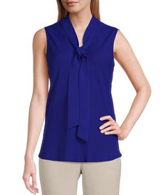 From Kasper, this blouse features:V-neckline with tie front sashSleevelessStraight hemlinePullover constructionPolyesterDry cleanImported. Elegant V-neck Top With Bow, Elegant V-neck Top With Tie Back, Chic Sleeveless Top With Tie Waist, V-neck Top With Bow For Spring, Spring V-neck Top With Bow Detail, Spring V-neck Top With Bow, Elegant Sleeveless Blouse With Tie Back, Elegant Sleeveless Tops With Tie Waist, Formal Sleeveless Top With Bow