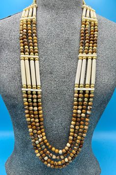 If you have ever been in the glorious Southwest, you have seen the elegant colors of the cliffsides and caverns of the desert.  This necklace is inspired by those earthy, muted colors. It is made of all natural picture jasper accented with brass and set with natural bone spacers and hairpipes.  The necklace comes with matching earrings made of the same picture jasper discs and hanging from brass lever back ear wires.  The ends are soft golden colored deerskin with long matching tie straps, making it possible to adjust to any length desired. Hair Pipe Bone Necklace, Native Dresses, Native Dress, Stone Bead Jewelry, Same Picture, Natural Picture, Bone Necklace, Elegant Colors, Deer Skin