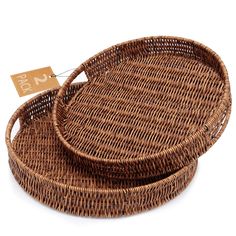 two round wicker trays with tags on them