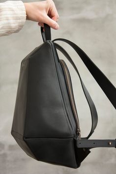 Comfortable leather backpack. Special and unique shape, a convenient construction is closed of a metal zipper-lock. Leather's outer distinctive feature - vintage look. It takes bends, creases or scratches if you hook on something. Scratches are easy to remove by rubbing the place with some soft fabric or even a finger. The leather is of high quality, keeps shape perfectly. This city-style travel bag is the perfect size for any of your daily essentials. In the middle of the backpack there is a po Minimal Purse, Blue Leather Wallet, Minimal Wallet, Simple Wallet, Brown Backpacks, Leather Making, Leather Rucksack, Mens Travel Bag, Wallets For Women Leather