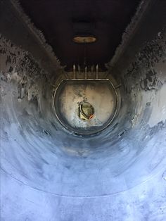 the inside of an old concrete tunnel