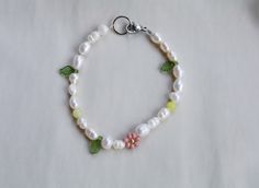 Pearl bracelet is handmade from the best materials. You can buy a sunflower bracelet as a gift for a friend, sister, or mother. MATERIALS of daisy flower bracelet: Pearls, pink pearl, seed beads, rose quartz heart and an extender chain (not in the picture). ALSO AVAILABLE AS A NECKLACE. SO YOU CAN A BUY A JEWELRY SET. https://www.etsy.com/listing/1276098651/lavender-beaded-flower-necklace-pearl SIZE of beaded bracelet : The Length is adjustable. A chain is added to each bracelet for additional c White Flower Bracelets For Everyday, Handmade Adjustable Pearl Bracelet For Spring, Handmade White Pearl Bracelet With Flower Shape, Delicate Flower Charm Bracelet For Spring, Handmade White Pearl Flower Bracelet, Handmade White Flower Pearl Bracelet, Handmade Pearl Bracelet For Summer Gifts, Summer Pearl Charm Bracelets As Gifts, Summer Pearl Charm Bracelet Gift