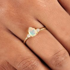 ⚫ Genuine Pear Design Ethiopian Opal Gemstone & Diamond Ring Solid 14K Yellow Gold Handmade Jewelry Wedding, Birthday Gift For Her ⚫ This ring is made with genuine Ethiopian Opal gemstone & diamonds in solid 14k yellow gold, ⚫ Solid 14K Gold Ethiopian Opal Gemstone Ring Handmade Pure Gold Jewelry. ⚫ Ethiopian Opal Ring, Engagement Ring, Wedding Bands, Gold Ring, Gemstone Ring. ⚫ Special customize for Anniversary, Birthday Gift, Valentine's, Mother's Day, Christmas. ⚫ Item Details: Gross Weight:- 14k Gold Moonstone Ring With Accent Stones For Wedding, Gold Multi-stone Rings For Wedding, Heirloom Three-stone Birthstone Wedding Ring, Gold Three Stone Birthstone Ring For Wedding, Three Stone Pear-shaped Jewelry Gift, Gold Cluster Ring With Three Stones For Wedding, Pear-shaped Three Stone Jewelry Gift, Yellow Gold Multi-stone Wedding Gift Jewelry, Gold Multi-stone Moonstone Ring For Wedding