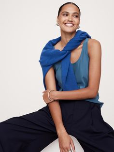 This relaxed tank is cut from our signature silk charmeuse with the matte side facing out to create a luxurious option for everyday.  Relaxed fit.  Scoop neck.  Straight hem.  Unlined.  Relaxed fit.  Sleeveless.  Hip length.  Model: Size S, 5'10" (178cm). Blue Stretch Camisole Tank Top, Blue Camisole Tank Top, Bra Friendly, Blue Scoop Neck Tank Top, Bra Friendly, Blue 4-way Stretch Tank Top For Yoga, Blue Moisture-wicking Sleeveless Tank Top, Silk Tank, Silk Charmeuse, Sleeveless Vest, Swimwear Cover Ups