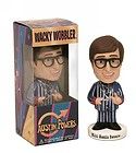 a bobble head with a striped shirt and glasses in front of a cardboard box