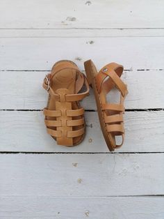 Greek Girls' Gladiator Sandals, Handmade of True Natural Greek Leather. Real Leather. Shipping worldwide from Athens Greece Centimetres: 11__11,6__12,3__13,6__15__16,6__17__17,6__18,3__19__19,6__20,3__21__21,6__22,3__23 EU: 18__19__20__21-22__23-24__25-26__27__28__29__30__31__32__33__34__35__36 Mommy and Me pairs are available for 30% discount. Please visit the below link to purchase both by using 30% discount code MOM30 Parent Company https://www.etsy.com/uk/shop/madammeshushu?ref=search_shop_r Summer Closed Toe Adjustable Sandals, Adjustable Closed Toe Summer Sandals, Closed Toe Adjustable Summer Sandals, Closed Toe Huarache Sandals With Soft Sole For Beach, Summer Beach Huarache Sandals With Soft Sole, Cute Adjustable Closed Toe Sandals, Handmade Summer Sandals With Round Toe, Open Toe Sandals For Spring Gift, Open Toe Sandals As A Spring Gift