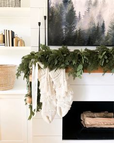 stockings hung on the mantle with greenery and candles