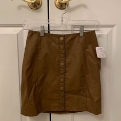 Brand New Free People Vegan Leather Mini Skirt. Light Brown With Button Closure In Front. Size 2. Never Worn, Tags Attached. Chic Brown Button-up Bottoms, Brown Mini Skirt With Button Closure For Work, Brown Mini Skirt With Button Closure, Trendy Brown Mini Skirt With Buttons, Brown Mini Skirt For Spring Workwear, Chic Brown Skirt With Button Closure, Spring Brown Skirt With Buttons, Brown Skirt With Button Closure For Summer, Spring Button-up Brown Skirt