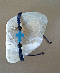 Blue Howlite Cross, Christian Bracelet, Cross Bracelet, Greek Orthodox Bracelet The Cross Bracelets are made with blue howlite cross, brown, black, gray, bordeaux and navy blue synthetic satin cord, matt black beads and silver tone metal beads. You can choose the cord color you want. ❥It is perfect for a gift to a friend or someone you love. SIZES: --------- Howlite cross: 12 mm x 15 mm Satin cord: 1 mm Black matt beads: 5 mm Metal silver tone beads: 3.2 x 2.6 mm Adjustable size in length with a Spiritual Handmade Blue Braided Bracelets, Blue Macrame Beaded Bracelets As A Gift, Adjustable Blue Rosary Bracelet With Cross, Blue Spiritual Bracelet With Adjustable Cord, Spiritual Blue Bracelet With Adjustable Cord, Spiritual Blue Bracelets With Adjustable Cord, Blue Spiritual Friendship Bracelets With Sliding Knot, Blue Spiritual Friendship Bracelet With Sliding Knot, Blue Spiritual Bracelet With Sliding Knot