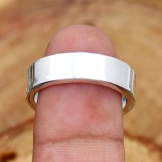 Plain Ring Band Ring 925 Sterling Silver Ring Wedding Band Simple Ring Stackable Ring 6 MM Band Ring Gift For Her Ready To ShipBand Height :6 MMBand Weight :7.90 GmMetal : Sterling SilverBase Metal : 925 parts per 1000Style : BandsMetal Purity : 925 parts per 1000*SAjewellersStore is the desire and happiness for jewellery designers and makers. Beautiful, intricate and unique design jewellery making supplies. Each piece is a beauty to behold. Made with precious gemstones and set in silver and met Polished Finish Band Gift, Adjustable Wide Band Promise Ring With Polished Finish, Sterling Silver Promise Ring With Thick Band, Adjustable Thick Band Anniversary Rings, Adjustable Thick Band Ring For Anniversary, Silver Polished Band Jewelry, Adjustable Silver Bands With Polished Finish, Polished Finish Band Jewelry For Gift, Polished Band Jewelry For Gifts