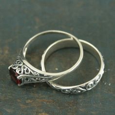 Garnet Bridal Ring Set--The Cinderella--Silver Antique Style Engagement Ring and Flourish Wedding Ba Gothic Engagement Ring Silver, Traditional Oval Filigree Wedding Ring, Traditional Hallmarked Filigree Ring For Wedding, Traditional Oval Wedding Rings, Engraved Toe Ring Jewelry For Wedding, Engraved Toe Ring For Wedding, Classic Wedding Ring Jewelry, Traditional Oval Engraved Wedding Ring, Traditional Oval Engraved Ring For Wedding