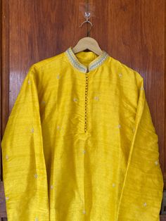 pure silk paithani mens kurta/mens kurta set/cream mens kurta /haldi mens kurta/Indian mens wear/chikankari kurta/groom wedding indian kurta/hand embroidered wedding kurta/yellow  kurta     Well..!! we understand that you may not get in your desired size/pattern, here you go with customization according to your size/pattern which we can deliver in 1-2 weeks of time period !!      Here is a beautiful pure silk yellow hand embroidered mens kurta with simple buti highlights as shown !!this Kurtas c Yellow Chanderi Sherwani Straight Kurta, Yellow Silk Kurta For Eid, Yellow Raw Silk Salwar Kameez With Chikankari Embroidery, Yellow Chikankari Embroidery Raw Silk Salwar Kameez, Yellow Chanderi Sherwani With Resham Embroidery, Yellow Sherwani With Resham Embroidery In Chanderi, Long Sleeve Slub Silk Sherwani For Festivals, Fitted Yellow Cotton Silk Kurta, Festival Long Sleeve Slub Silk Sherwani