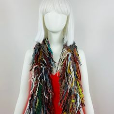 Long chunky knit scarf with Multi colored fringe all over the entire scarf. Width is aprox. 2" - not including the fringe. Length is 70" long Made from cotton , nylon blend yarn Retail was $149.00 the first pic show the brown yarn seems to be washed out from shooting out side or it could be a whole different scarf!  I Just want to show how it lays on a model. They are the same style for sure. Bohemian Yarn Scarves For Fall, One Size Bohemian Acrylic Scarves, Bohemian One Size Acrylic Scarves, Bohemian Acrylic Scarves One Size, Bohemian Knit Scarves For Fall, Fall Scarves In Yarn Material, Fall Yarn Scarves One Size, One Size Bohemian Scarves With Fringe, Multicolor Acrylic Yarn Scarves For Fall