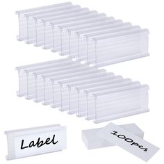 clear plastic name badges and labels with black ink on white paper next to each other