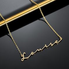 Sleek and elegant, our Mon Petit Name Necklace creates an effortless signature look that is stunning next to your skin. Personalize your necklace with your name or surprise them with a meaningful gift today. Modern Gold Personalized Name Necklace, Modern Personalized Gold Name Necklace, Modern Gold Name Necklace For Gifting, Modern Gold Name Necklace For Gift, Elegant Personalized Stainless Steel Charm Necklaces, Elegant Rose Gold Stainless Steel Name Necklace, Minimalist Sterling Silver Name Necklace For Formal Occasions, Elegant Stainless Steel Name Necklace For Personalized Gift, Elegant Stainless Steel Name Necklace As Personalized Gift