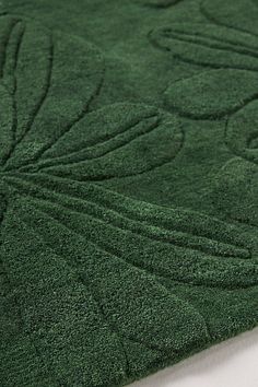 a close up view of a green rug