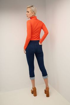 An everyday favorite, this skinny fit Capri jean offers the perfect blend of comfort and practicality thanks to its wide smoothing contour waistband that has a hidden elastic for easy pull-on styling with no need for buttons or zippers. The 25” inseam has been paired with a slim and fitted leg cut that slims down the body and makes it appear virtually airbrushed. Meanwhile, the mid-rise waistband lies just beneath the navel for all-day comfort. Metal rivets and a “R” logo to the back pockets. Th Trendy Stretch Mid-rise Cropped Jeans, Trendy Stretch Cropped Jeans For Fall, Spring Slim Fit Elastane Jeggings, Stretch Dark Wash Cropped Jeans, Stretch Cropped Leg Jeans In Dark Wash, Stretch Cropped Jeans In Dark Wash, Trendy Slim Fit Jeggings For Fall, Stretch Mid-rise Bottoms With Rolled Hem, Stretch Mid-rise Cropped Jeans For Fall