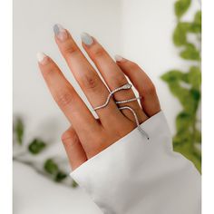 Our Twisted Serpent Double Finger Ring is a unique, edgy ring that wraps around two of your fingers. You will be sure to make a statement with this ring at parties and music festivals! Adjust them to fit your fingers. They are flexile and made to be adjusted. Snake eyes are dark green Material: Copper base Modern Adjustable Rings For Party, Modern Adjustable Party Rings, Trendy Party Ring Jewelry, Minimalist Open Ring Jewelry For Party, Minimalist Open Ring For Party, Trendy Open Ring For Promise Occasion, Trendy Open Ring For Promise, Trendy Adjustable Crystal Ring For Parties, Trendy Adjustable Jewelry With Ring Detail