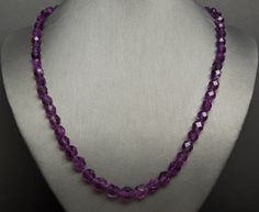 Vintage Mid-Century Circa 1960 with numerous Genuine Earth-Mined Faceted Natural Intense Purple Amethyst beads slightly graduated ranging from approximately 6mm to 8.5mm at central section  (largest) Hand-Knotted on a Purple Cotton Silk cord as well NOTE:  some do contain natural internal inclusions, as well as some with indications of striation (inclusions coming up to surface of stone) .. characteristics of naturally earth-mined Gemstones --Refer to close-up photo as well as in natural dayligh Silk Cord, Amethyst Beads, Amethyst Necklace, Multi Strand Necklace, Strand Necklace, Multi Strand, Purple Amethyst, Cotton Silk, Last Minute Gifts