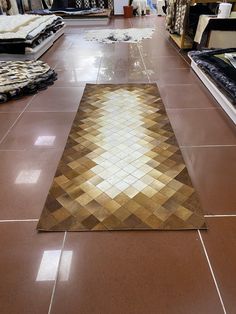 the floor is covered with brown and white tiles, which are lined up on top of each other