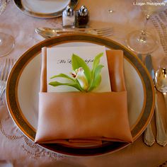 a place setting with napkins and silverware