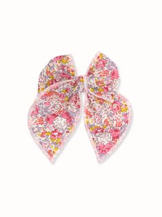 The perfect accessory for everyday or party look. 100% cotton Liberty of London fabric in Tana Lawn pink and purple floral print. Silver-tone alligator clip with teeth. The bow measures approximately 4.5 x 5.0 inches * Due to the nature of our handmade bows each bow may look slightly different. * This hair accessory is not a toy, we recommend not to play with it. It may contain small parts that potentially could be dangerous to small children, please supervise your child while wearing our hair a Pink Hair Bow Accessories For Spring, Spring Pink Hair Accessories With Bow, Pink Ribbon Bow For Spring, Cute Cotton Bow Hair Accessories, Playful Pink Hair Accessories With Bow, Cute Pink Summer Bow, Liberty Of London Fabric, Purple Floral Print, Party Look