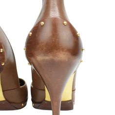 Gucci pointed-toe pumps in brown with over-exaggerated heel tabs. Features gold studs along the heel and toe sole and gold sole. Brand = Gucci Condition = 8/10, Very good, scuffing to heels and toes Size = Women's 8 US Heel Height = 110mm Material = Leather Hardware = Gold SKU = 3036-8 Studded Fitted Heels For Formal Occasions, Formal Studded Fitted Heels, Formal Fitted Studded Heels, Gucci Pointed Toe Heels For Work, Gold Studs Pointed Toe Heels, Elegant Gold Heels With Studs, Elegant Gold Studded Heels, Gucci Brown High Heel Heels, Gucci Brown High Heels