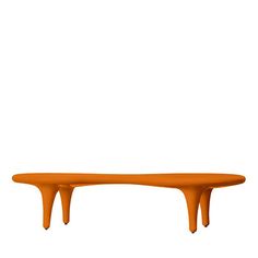 an orange table sitting on top of a white floor