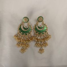 This piece of jewelry pairs perfect with your south asian attire, for weddings, eid, or any special event. All jewelry has been made in Pakistan and is ready to wear. If you have any questions please do not hesitate to reach out to me. Luxury Green Elegant Jhumkas, Green Drop Earrings Danglers For Festivals, Indian Style Earrings, Green Pearl Earrings, South Asian Jewelry, Asian Attire, Earring Indian, Fashion Collection Inspiration, Asian Jewelry