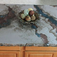 a marble counter top with various types of decorations on it