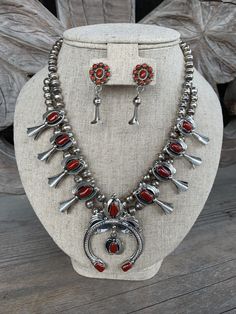 "SOLD AS SET ONLY // Beautiful sterling silver and rare Coral squash blossom necklace with accompanying earrings. Necklace signed by artist C. Davis Necklace Length: 11.5\" Naja: 2.75x2\"" Antique Silver Sterling Silver Bangle, Artisan Red Sterling Silver Jewelry, Southwestern Style Polished Bangle, Southwestern Style Jewelry With Oxidized Finish, Southwestern Style Oxidized Round Jewelry, Southwestern Nickel-free Bangle Jewelry, Nickel-free Southwestern Style Bangle, Southwestern Style Hallmarked Round Jewelry, Southwestern Style Nickel-free Bangle