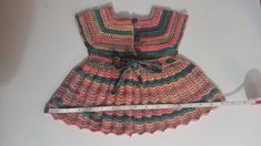 This dress is made from yarn by knitting with needles by hand. Cute Multicolor Winter Dresses, Cute Fitted Knit Dress, Handmade Multicolor Cotton Dresses, Handmade Fitted Pink Dress, Multicolor Knit Dresses For Winter, Cute Handmade Pink Dress, Fitted Crochet Cotton Dress In Cute Style, Cute Fitted Crochet Cotton Dress, Cute Fitted Crochet Dress