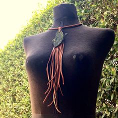 "-This gorgeous bohemian necklace has a unique agate stone hanging from a leather-wrapped collar. -Deerskin leather tassel contains vintage brass chains, and drapes 11\" down the chest. -The collar is adjustable from 15\" - 17\" including a 2\" adjuster chain. Longer adjuster chains available by request. -Diameter of collar is about 5.5\". -Each agate stone is unique, but approximate size is 3\" x 1.5\". -Designed and handmade in South Pasadena, CA. -Model shown also wearing our leather cuffs an Bohemian Hand Knotted Agate Jewelry, Bohemian Hand-knotted Agate Jewelry, Bohemian Leather Jewelry Hand Wrapped, Bohemian Agate Lariat Necklace, Bohemian Leather Pendant Necklace, Bohemian Lariat Jewelry With Fringe, Bohemian Fringe Necklaces For Gifts, Bohemian Leather Lariat Jewelry, Bohemian Leather Necklace For Festivals