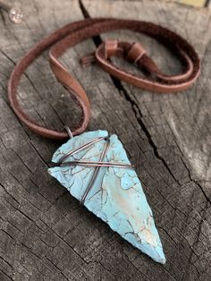 "This is my fresh spin on a wire wrapped classic. Arrowheads have been worn as jewelry for ages and are a recognizable symbol of alertness, walking the straight and narrow & strength. The arrowhead I used is made of jasper stone and is a hand knapped modern replica. It was made in the same tradition and with the same primitive techniques that early man used. I added a lovely pale turquoise & gold highlight patina then wire wrapped it with blackened (oxidized) copper wire. This is a great Adjustable Southwestern Hand Wrapped Jewelry, Southwestern Hand Wrapped Adjustable Jewelry, Southwestern Adjustable Hand Wrapped Jewelry, Adjustable Southwestern Style Hand Wrapped Jewelry, Artisan Necklace With Adjustable Patina, Adjustable Turquoise Necklace With Patina, Artisan Adjustable Turquoise Necklace Nickel Free, Artisan Adjustable Turquoise Necklace Wire Wrapped, Adjustable Turquoise Pendant Necklace Nickel Free