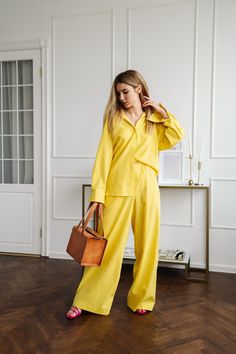 Long Sleeve Oversize Yellow Linen Shirt is ideal for everyday wear. This linen shirt features a comfortable fit, has an effortlessly chic, oversized silhouette with buttoned cuffs. The linen material is lightweight and breathable, making it perfect for warmer weather. It is recommended to be paired with palazzo trousers or shorts for a stylish and comfortable look.  For more information feel free to ask questions. DETAILS:  * Minimalist style  * Oversize  * Long sleeves  * Buttoned cuffs MATERIA Luxury Yellow Relaxed Fit Tops, Chic Oversized Yellow Top, Yellow Linen Shirt, Oversized Yellow Tops With Button Closure, Chic Yellow Button-up Top, Chic Yellow Wide-leg Set, Style Oversize, Linen Shirts Women, Shirt Linen