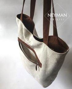 This beige thick canvas furniture textile bag is highly durable and comfortable for every day use. Its simple design makes it perfect for any and every occasion like work, shopping, beach, going out etc. The bag is really very roomy, so you can use it as travel bag as well. The combination of beige canvas and brown vegan suede leather elements gives the bag a unique look. The wide handles comfortably fit your shoulders. It has a big side pocket with zipper. The medium inner pocket is perfect for Rectangular Cream Bag With Canvas Lining, Rectangular Cream Bags With Canvas Lining, White Canvas Tote Shoulder Bag, Cream Rectangular Bags With Canvas Lining, Cream Shoulder Bag With Canvas Lining For Shopping, Cream Rectangular Bag With Canvas Lining, Cream Shoulder Bag With Canvas Lining And Double Handle, White Shoulder Bag With Canvas Lining For Shopping, Beige Bag With Canvas Lining For Everyday Use