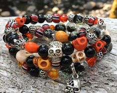 the bracelets are decorated with skulls and beads