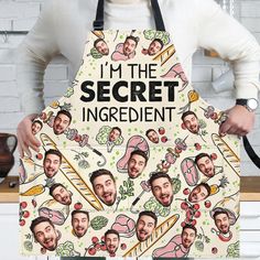 a man holding an apron with the words i'm the secret ingredient on it