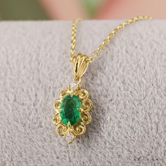 "Complete your vintage-inspired ensemble with our Art Deco Emerald Pendant Necklace. This exquisite piece, available in 14K and 18K gold options, features a captivating natural emerald at its center, and diamonds. A timeless addition to your jewelry collection, perfect for adding a touch of glamour to any occasion. F E A T U R E S 💎 D I A M O N D Carat: 0.04 Quality: VS1 Color: F-G Cut: Round 💠 G E M S T O N E Type: Natural Emerald Carat: 0.45 Cut: Oval 🌟 M A T E R I A L Gold: Available in 14K and 18K Options Color: Choices of White, Rose, or Yellow Chain: Cable Closure: Spring Ring 🎁 Extra Touch: As a testament to our dedication to exceptional customer service, each purchase is accompanied by a complimentary product certificate. Your order will be elegantly presented in a stylish box Exquisite Emerald Necklace For Anniversary, Oval Emerald Necklaces For Wedding, Exquisite Oval Emerald Necklace For Wedding, Elegant Yellow Gold Emerald Necklace, Elegant Oval Emerald Necklace For Wedding, Wedding Oval Emerald Necklace With Jewels, Classic Emerald Pendant Necklace For Wedding, Classic Emerald Necklace For Wedding, Classic Hallmarked Emerald Necklace For Wedding