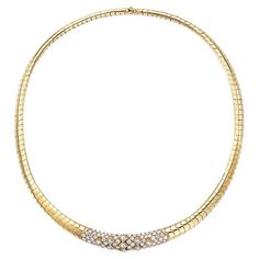 A prestigious piece by Van Cleef & Arpels, this flexible collar necklace is pavé set with an opulence of white diamonds, weighing approximately 5.6 carats , all finely mounted in 18 karat yellow gold. weight of the necklace is 115 gm. Center Plaque is set with round brilliant cut and princess cut diamonds 82 round diamonds , 4.5 ct 9 Princess cut diamonds 1.10 Ct Signed Van Cleef & Arpels. # 50751 Luxury Gold-plated Yellow Gold Choker, Luxury Yellow Gold Necklace For Ceremonial Occasions, Formal Diamond Choker Necklace In Fine Jewelry Style, Formal Fine Jewelry Diamond Choker Necklace, Fine Jewelry Diamond Choker Necklace For Formal Occasions, Classic Formal Diamond Choker Necklace, Diamond Choker Necklace With Diamond Accents, Luxury Diamond Choker For Formal Occasions, Formal Diamond Tennis Necklace Choker