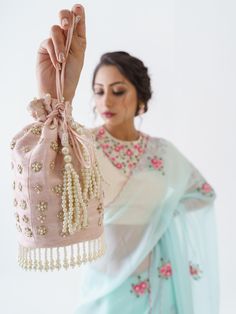 This is a three-piece light blue floral saree set from the Suruchi Parakh collection. The light blue floral saree is paired with an embroidered off-white blouse. The blouse has padding and a back hook opening with a cut-out detail. There are beautiful floral motifs of zardozi, pearl and thread work all over the blouse and saree. This saree set is crafted in soft organza and tussar silk fabrics. The outfit is completed with an inner skirt for the saree.
Clutch NOT included. Tissue Silk Sets For Reception, Bollywood Style Light Blue Sharara, Light Blue Traditional Drape Set With Resham Embroidery, Light Blue Pre-draped Saree For Wedding, Elegant Semi-stitched Light Blue Set, Traditional Light Blue Sharara For Reception, Light Blue Designer Saree Set, Designer Light Blue Saree Set, Designer Light Blue Sets With Zari Work