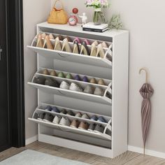 Create a clutter-free space for shoes or accessories with this clean-lined storage cabinet. Ideal for an entryway or living room, this cabinet features three drop-down drawers that open to reveal room for up to 18 of your favorite flats, sneakers, and heels. The freestanding frame is made from solid and engineered wood with a clean white finish that's scratch-free, and it rests on a plinth-style base for a complete the look. Plus, the surface on this cabinet is great for displaying accent pieces Shoe Storage Cabinet With Doors, Shoe Rack Cabinet Design, Flip Door, Shoe Rack Cabinet, Narrow Shoe Rack, Storage Cabinet With Doors, Cabinet With Doors, Entryway Shoe, Shoe Rack Organization