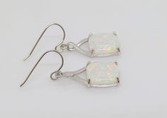 Vintage Sterling Silver Cushion White Opal CELTIC Dangle Earrings ....Marked 925...Total of weights 3.7grams...Measure H 1 2/8'' W 2/8''...These are in very good condition. White Nickel-free Earrings For Formal Occasions, White Nickel-free Formal Earrings, Nickel-free White Earrings For Formal Occasions, Formal White Nickel-free Earrings, White Sterling Silver Rectangular Jewelry, White Rectangular Sterling Silver Jewelry, Sterling Silver Drop Earrings With Bail, Nickel-free White Rectangular Jewelry, Hallmarked Rectangular White Jewelry