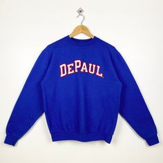 Vintage NCAA DePaul University Blue Demons Crewneck Sweatshirt Embroidery Blue Color Men's S - Made in Honduras - Materials : Cotton, Polyester  - Tag Reads : S Kindly see the actual measurements (All measurements were taken lying flat) - Actual size manual measurements * Width (Armpit to armpit) : 21 inches * Length (Shoulder to end of garment) : 25 inches * Sleeve length : 24.5 inches - Condition : * Vintage condition 8/10 (80%) * Minor stain refer picture * Free from any tear and major defect Blue Crew Neck Sweatshirt With Embroidered Logo, Blue Long Sleeve Sweatshirt With Embroidered Logo, Collegiate Blue Top With Embroidered Logo, Blue Varsity Sweatshirt With Embroidered Logo, Blue Embroidered Text Sweatshirt With Relaxed Fit, Blue Crew Sweatshirt With Embroidered Graphics, Blue Winter Sweatshirt With Embroidered Logo, Winter Blue Sweatshirt With Embroidered Logo, Blue Relaxed Fit Sweatshirt With Embroidered Graphics