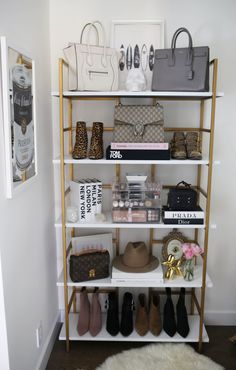 a white shelf filled with lots of purses and handbags on top of it