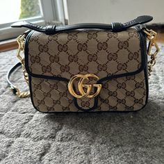 Gucci Shoulder Or Crossbody Bag. Never Worn Or Used. 22in Removable Strap. Bag Is Approximately 9x7x3. Comes With Dust Bag. Brown Top Handle Bag With Cc Turnlock Closure, Designer Gucci Bags With Cc Turnlock Closure, Designer Brown Shoulder Bag With Cc Turnlock Closure, Gucci Leather Shoulder Bag With Cc Turnlock Closure, Classic Gucci Shoulder Bag With Cc Turnlock Closure, Chic Gucci Shoulder Bag With Cc Turnlock Closure, Chic Gucci Shoulder Bag With Cc Turnlock, Gucci Gg Marmont Mini, Gg Marmont Mini