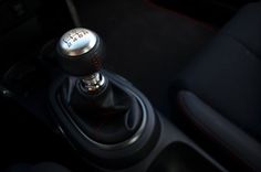 an automatic gear stick in a car with the shift button on